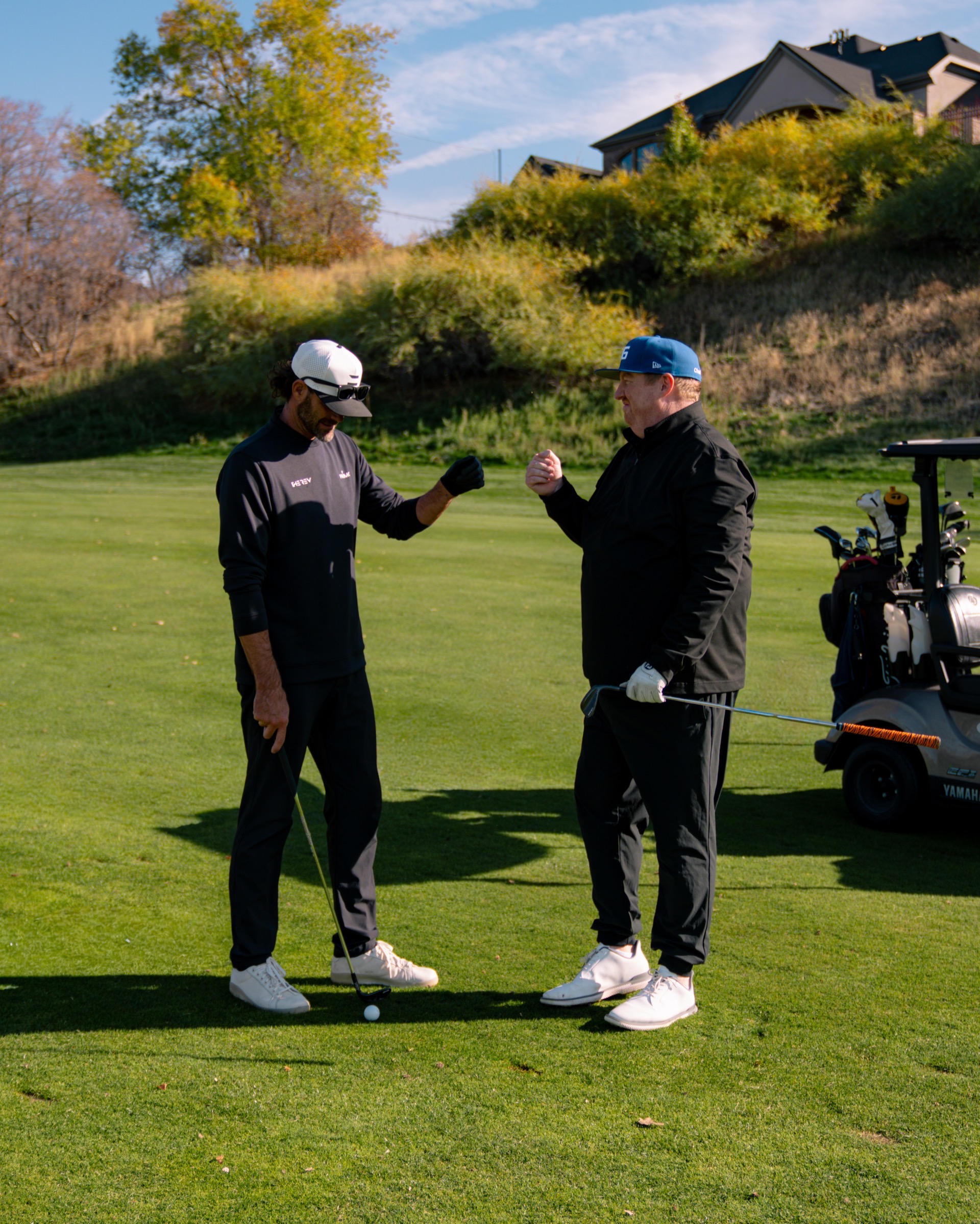 REV Tour players fist bumping on the course
